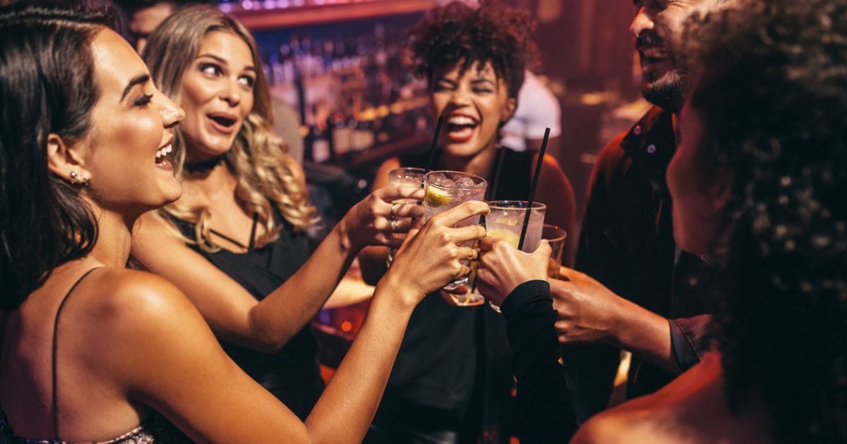 Group of people enjoying drinks in a bar