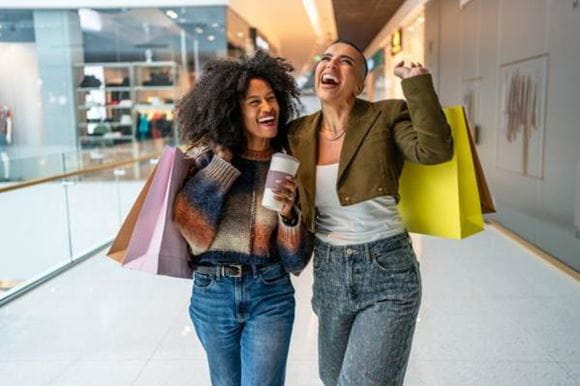 stock image of two women in a shopping mall