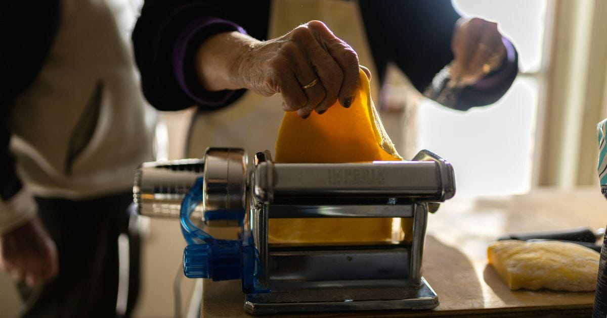Stock image of a person making pasta by hand