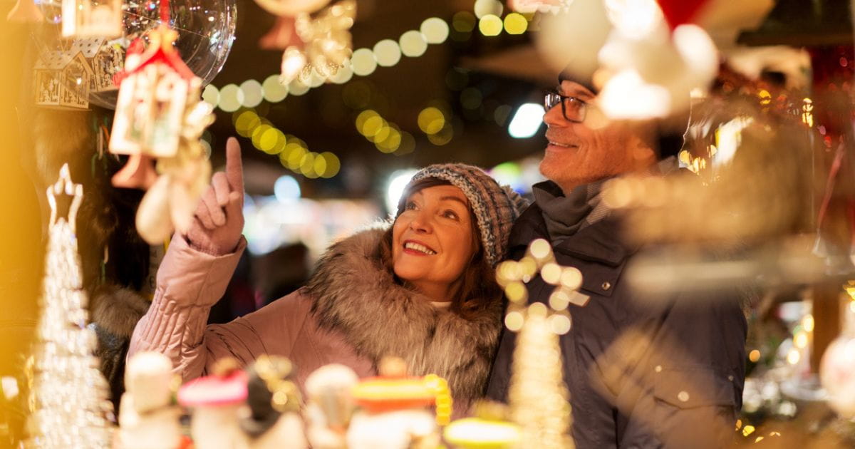 A couple browsing a Christmas market