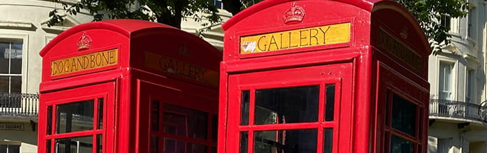 Closeup of red telephone boxes as part of an art gallery