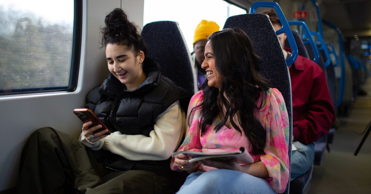 Thameslink brand image of women on a Thameslink train