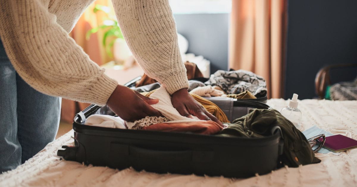 A woman packing a suitcase for holiday