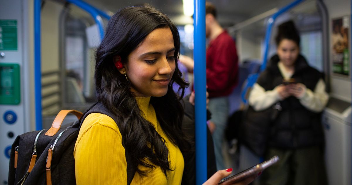 A woman taking the train to the airport