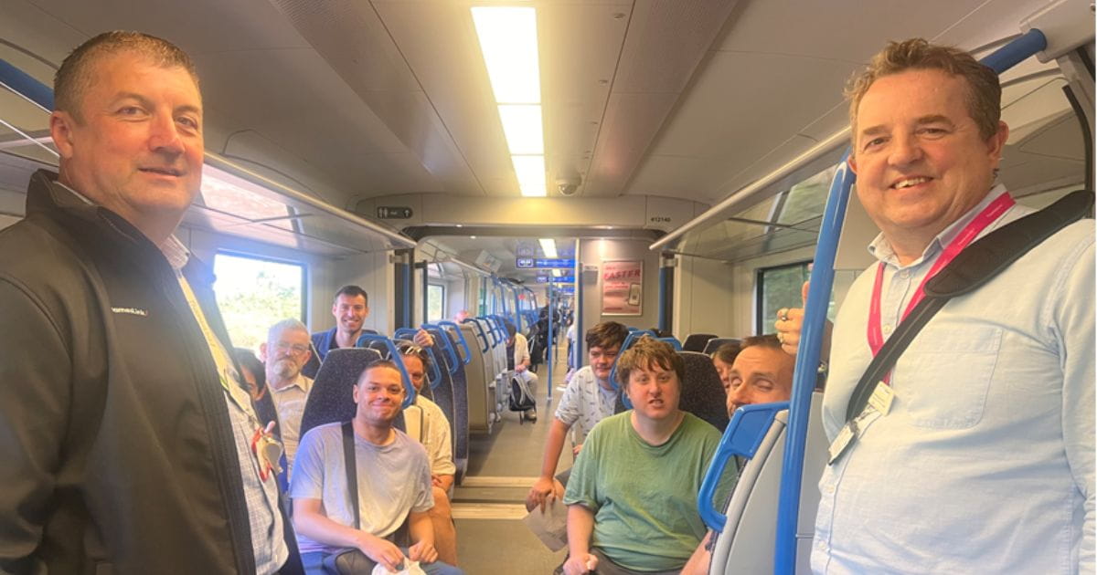 Thameslink station manager Joe Healy with Try A Train passengers
