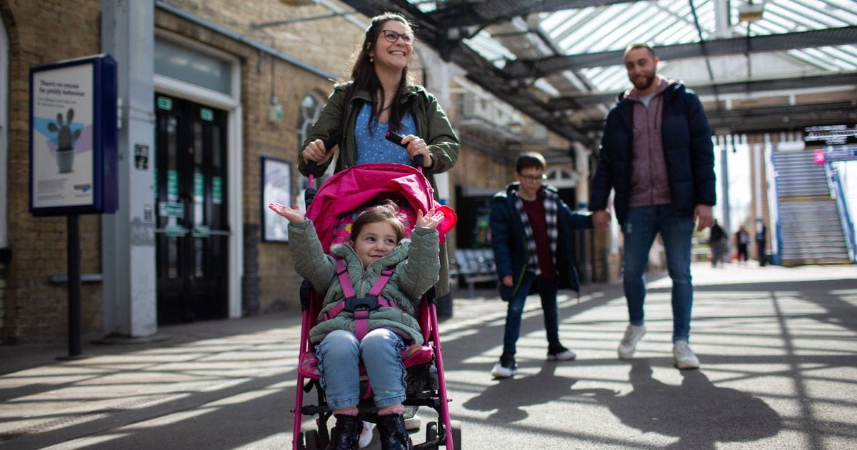 Family on a railway station platform