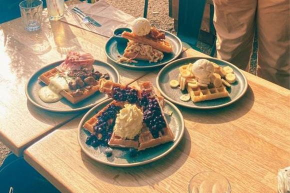 An image of sweet and savoury waffles on a table